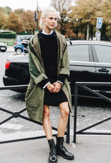 With black mini dress and olive green loose coat