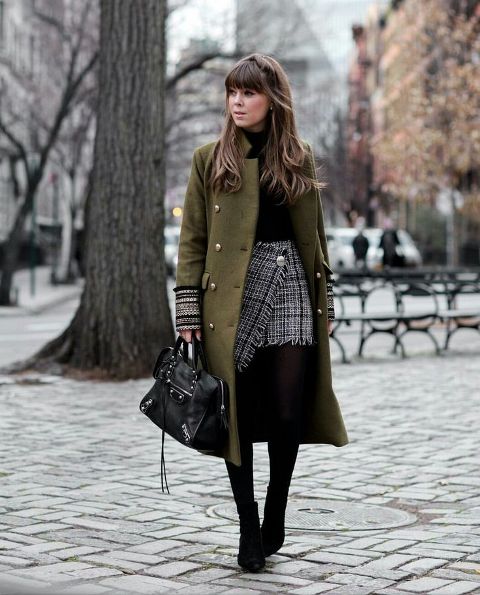 With black turtleneck, checked wrap mini skirt, black ankle boots and black leather bag