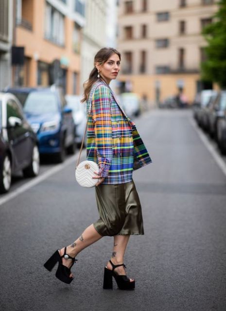 With colorful checked blazer, white rounded bag and black platform shoes