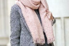 With distressed pants, gray sweater, brown clutch and gray coat
