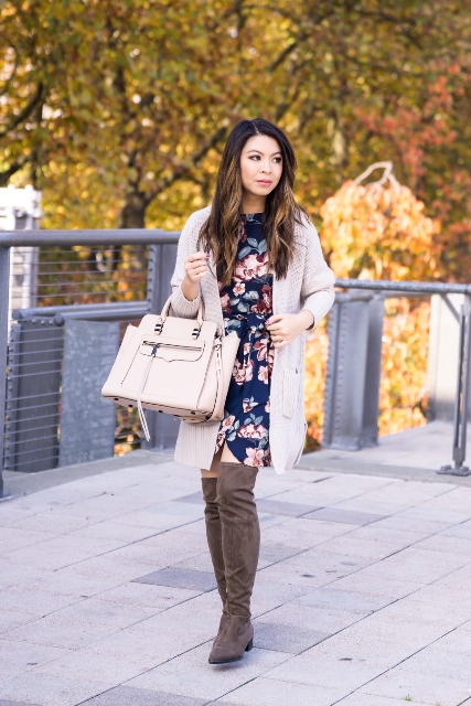 With gray cardigan, beige bag and gray over the knee boots