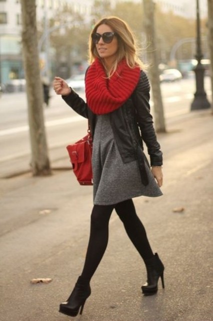 With gray mini dress, red bag, high heeled boots and black leather jacket
