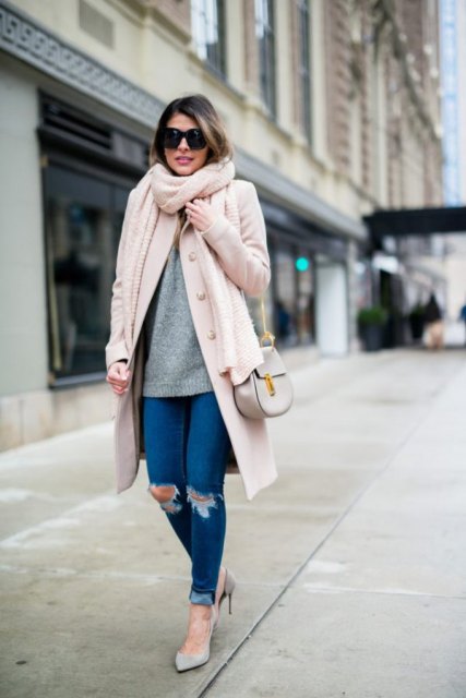 With gray sweater, pale pink coat, gray chain strap bag and gray pumps