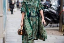 With green printed oversized dress and printed bag