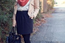 With lace blouse, mini skirt, high heels, beige jacket and black bag
