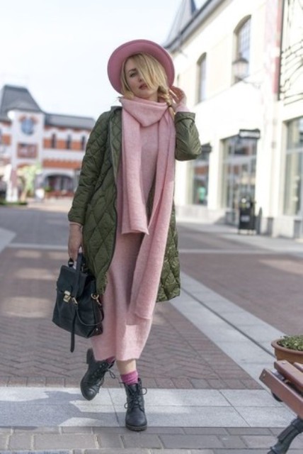 With pale pink midi dress, olive green coat, hat, black bag and lace up boots
