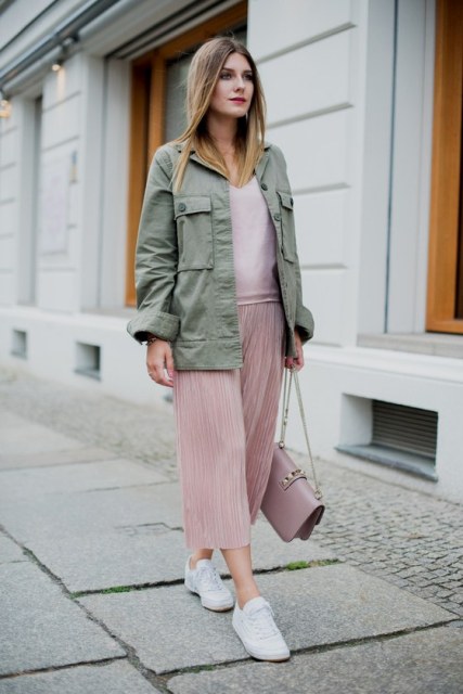 With pale pink shirt, olive green jacket, chain strap bag and white sneakers