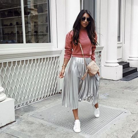 With pink sweater, beige tassel bag and white sneakers