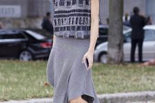 With printed shirt and gray skirt