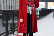 With red coat, chain strap bag, black cuffed trousers and black ankle boots