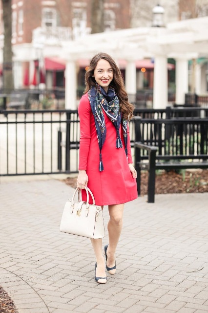 With red mini dress, white bag and two colored pumps