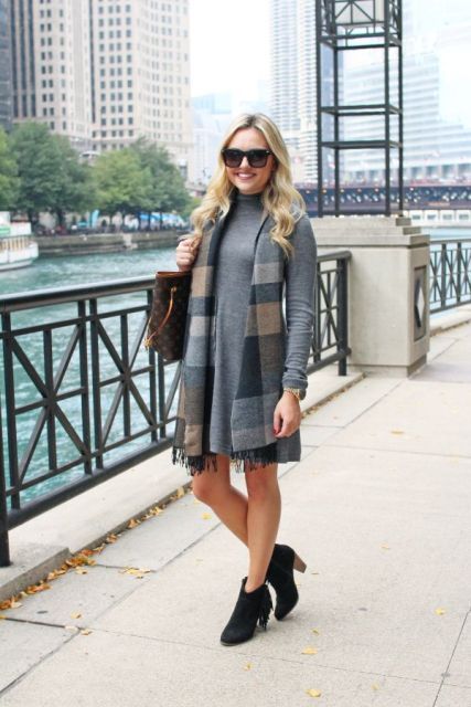 With sweater dress, printed tote bag and black fringe boots