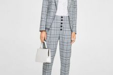 With white V-neck shirt, gray checked blazer, white bag and white sneakers