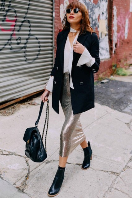 With white blouse, black long blazer, backpack and black ankle boots