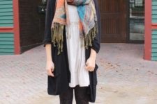 With white dress, black cardigan and tassel scarf