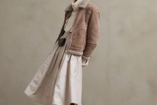 a catchy winter look with a creamy sweater, a creamy midi skirt, a brown short shearling coat and brown boots