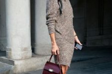 a short fitting brown sweater dress, white sneakers, a burgundy bag for a comfy look