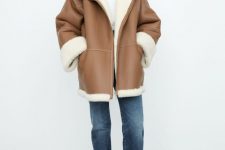 a tan short shearling coat with white fur, with an oversized silhouette is a stylish outerwear piece