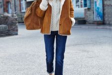a white sweater, navy straight jeans, classic brown brogues, a brown shearling coat and a matching bag