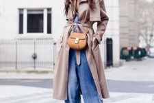 With beige trench coat, brown bag and brown suede boots
