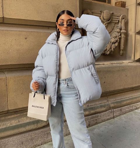 With beige turtleneck, light blue jeans and sunglasses