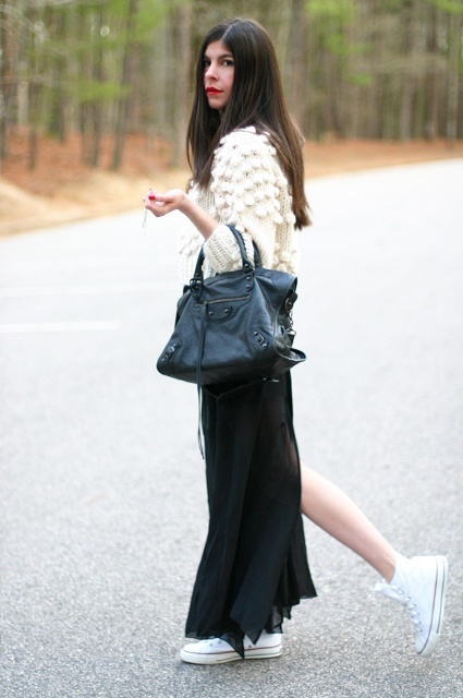 With black maxi skirt, white sneakers and black leather bag