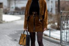 With black sweater, brown suede belted skirt, bag and platform boots