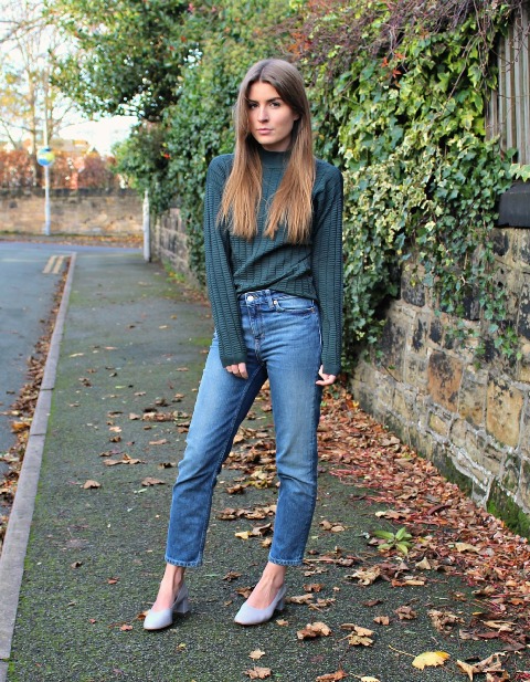 With classic jeans and light blue low heeled shoes