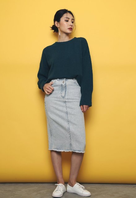 With denim midi skirt and white sneakers