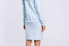 With light blue knee-length skirt and black and white sneakers