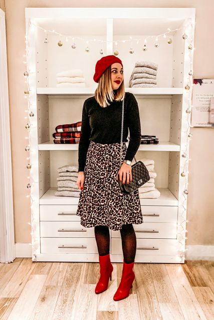 With marsala beret, black turtleneck, chain strap bag and red mid calf boots