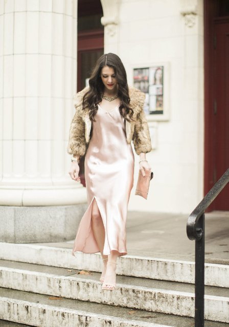 With pale pink satin maxi dress, clutch and high heels