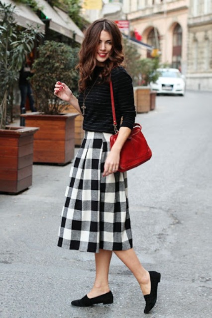 With striped shirt, red bag and flat shoes