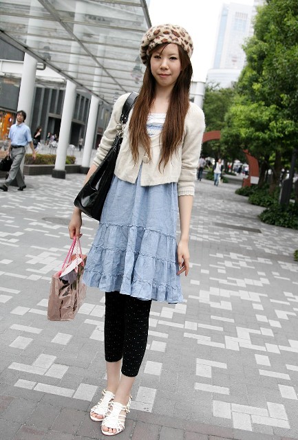 With white cardigan, blue dress, leggings, white shoes and black bag