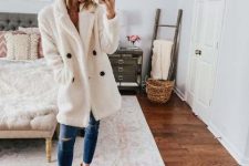 With white faux fur coat, beige shirt, cropped jeans and white ankle boots