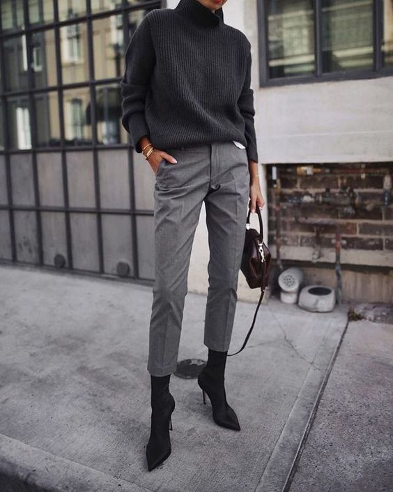 a black oversized turtleneck sweater, grey cropped pants, black sock boots and a small bag for winter