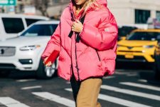 a bold casual look with a pink puff coat, tan pants, white Chelsea boots is all you need this winter