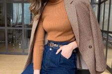 a business casual look with a rust-colored turtleneck, deep blue jeans, a plaid blazer for a chic feel