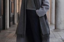 a comfy casual look with a grey turtleneck sweater, navy striped pants, white sneakers, a grey scarf and a grey coat