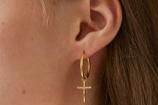a gold hoop earring with a cross is a timeless idea that always works and that will be always actual
