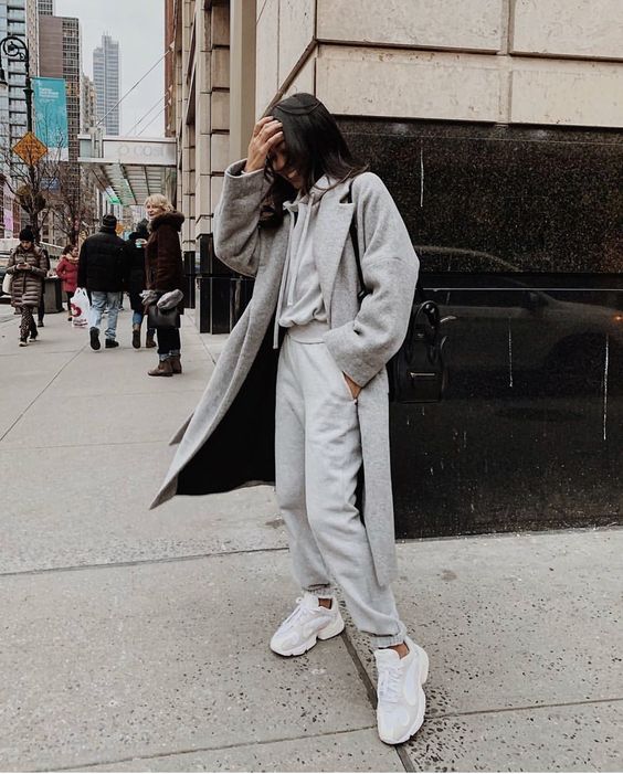 a grey cashmere hoodie and joggers, a grey coat and white trainers for comfy and cozy everyday look
