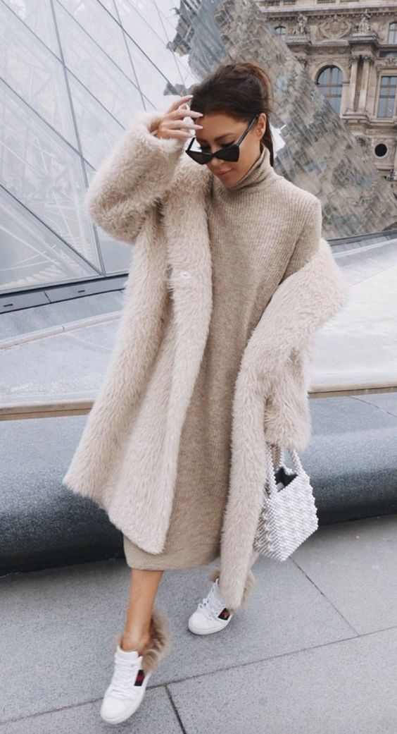 a light grey midi sweater dress, white trainers, an ivory fuzzy faux fur coat and a white beaded bag for a romantic look