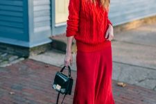 a red braided sweater, a deep red midi skirt, grey booties and a small black bag for a super chic winter look