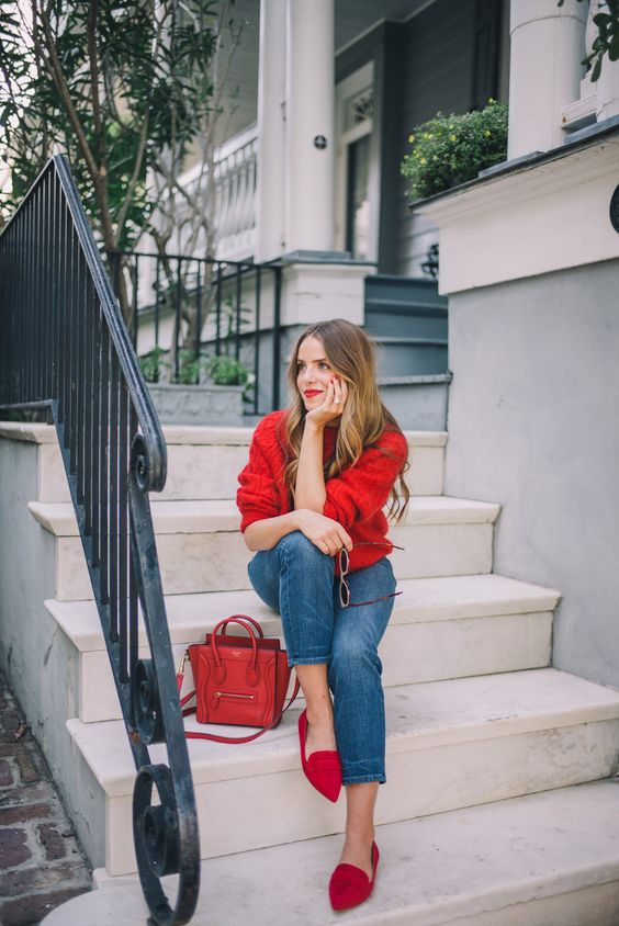 a red sweater, blue jeans, red moccasins and a red bag plus lip and nails for a holiday-inspired look