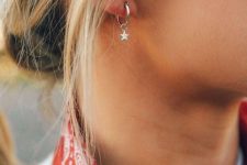 a silver hoop earring with a silver star is a lovely accessory that will match most of outfits you rock