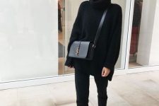 a simple look with a black oversized sweater, black jeans, white sneakers, a black crossbody bag