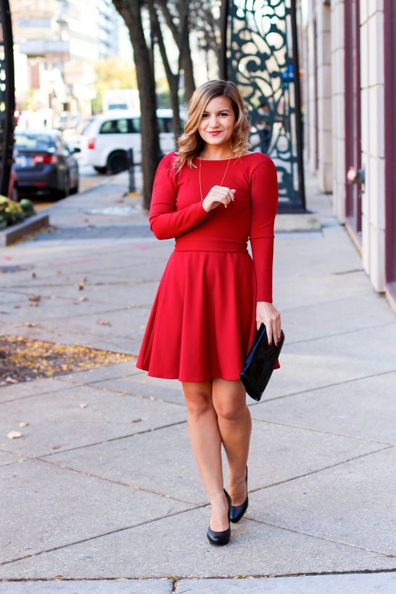 a simple yet cute red A-line dress with long sleeves, a black clutch and shoes will be a nice outfit for a holidya party