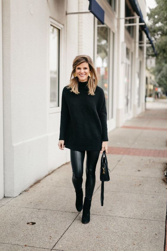 a total black look with leather leggings, an oversized turtleneck sweater, suede booties and a bag is chic