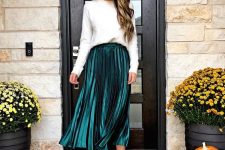 a white jumper, a metallic hunter green pleated midi, leopard shoes and statement earrings for Christmas