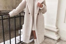 a white mini sweater dress, white tall boots and a faux fur midi coat for a lovely and romantic look